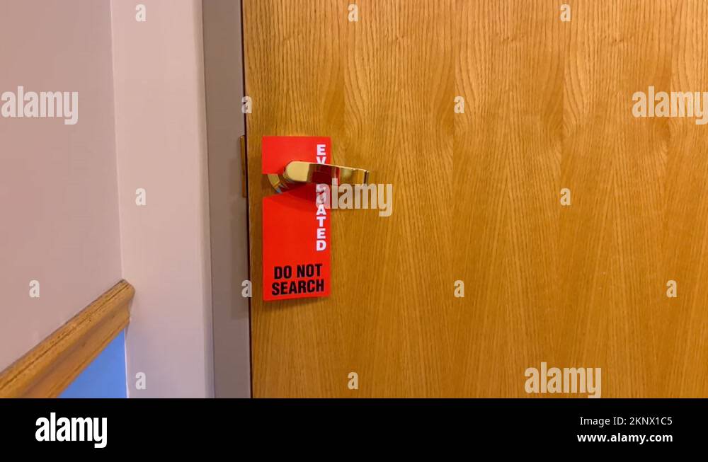 Evacuated Do Not Search bright orange and red sign on Doctor’s office ...