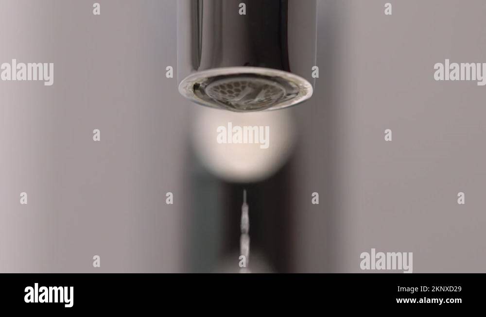 Mixer valve. Water drip drops from a water pipe. Closed faucet tap