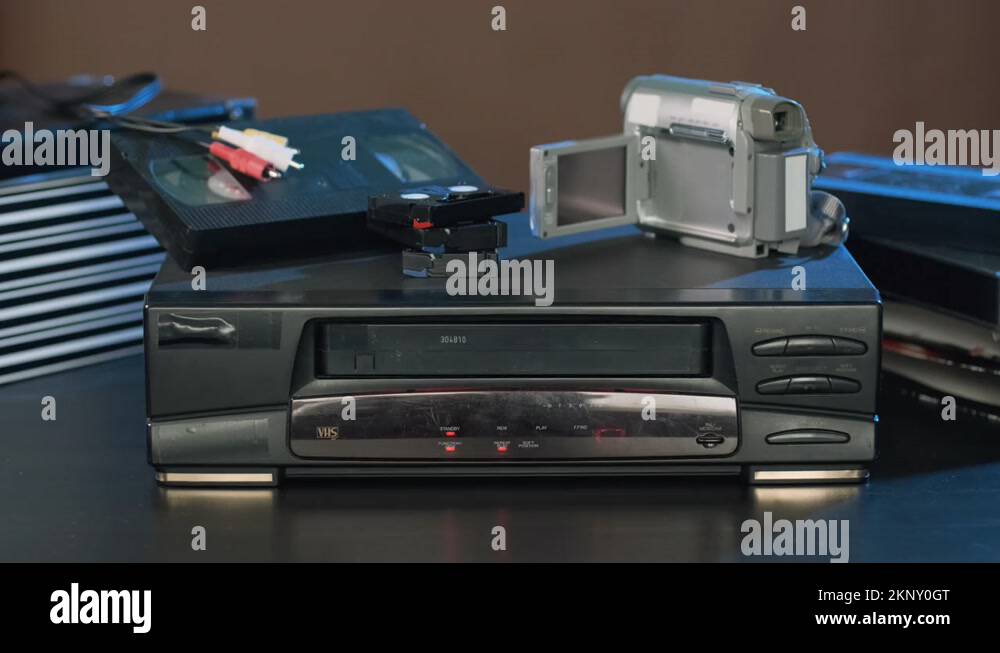 Man Ejecting Tape from VHS Video Player Stock Video Footage Alamy