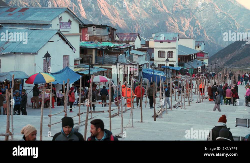 Pilgrims, Houses, And Stalls By The Himalayan Range In Kedarnath Stock