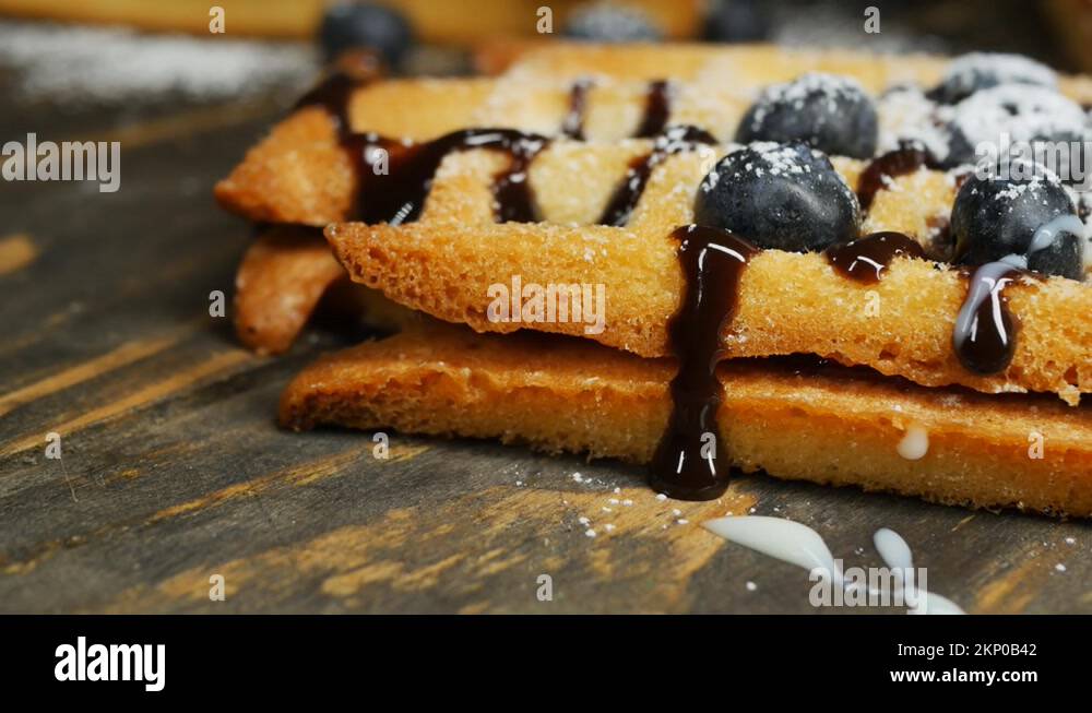 crispy Belgian waffles with blueberries, chocolate filling and ...