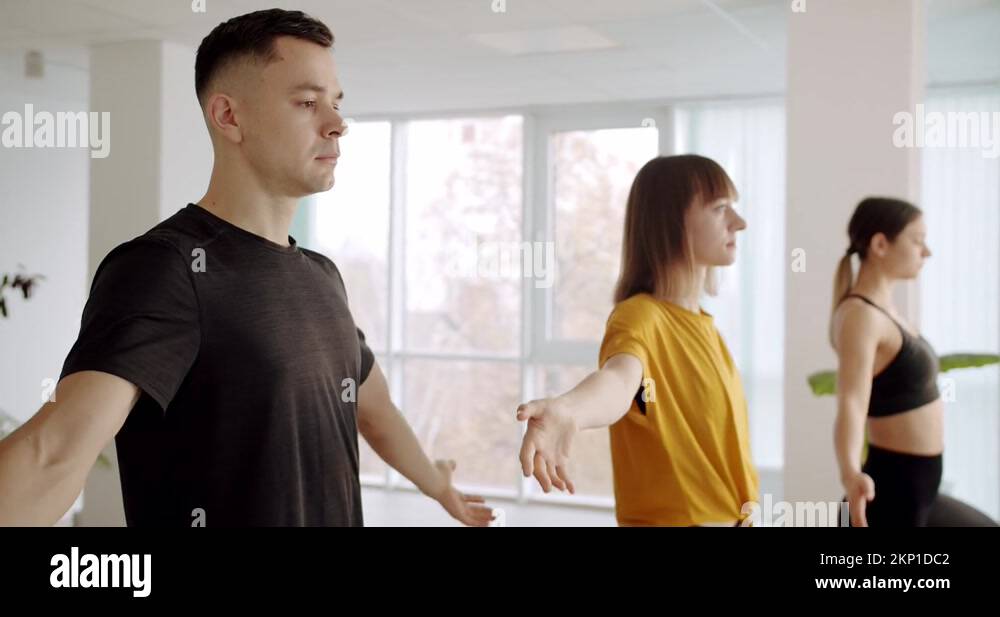 Namaste. Relaxing after group exercises in class room. Yoga Club