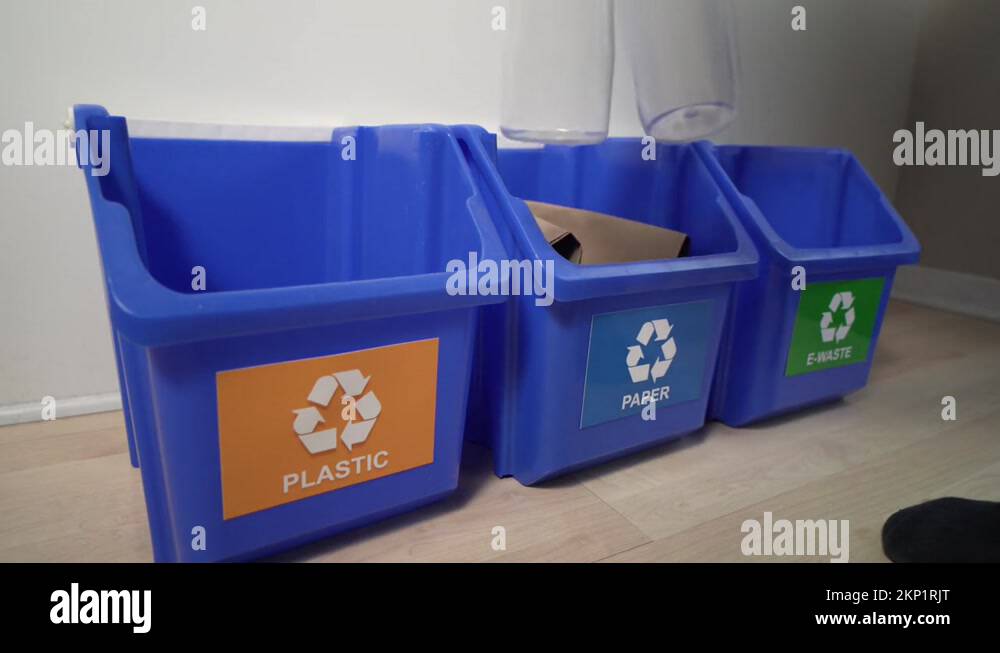 Recycling Paper and Plastic in Different Selective Recycle Bins Stock