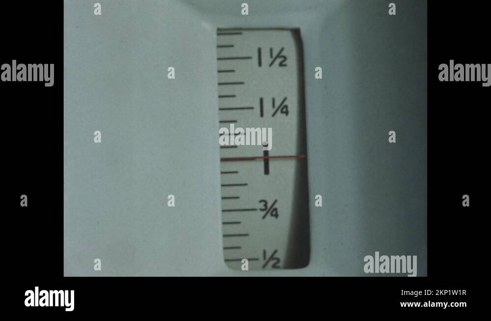 1950s Needle on gauge of scale points to one pound. Needle on gauge of scale Stock Video