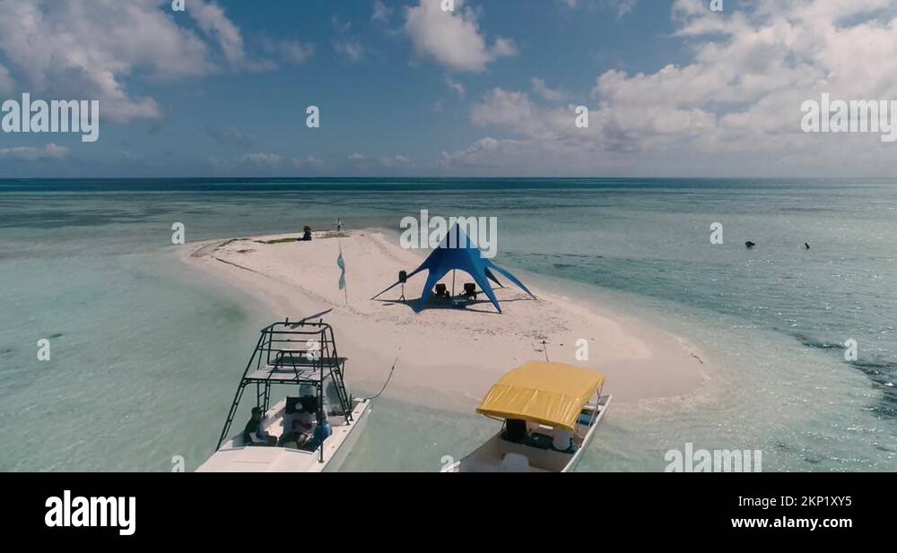 Zoom out from luxury tent in glamping campsite in remote atoll in Stock ...