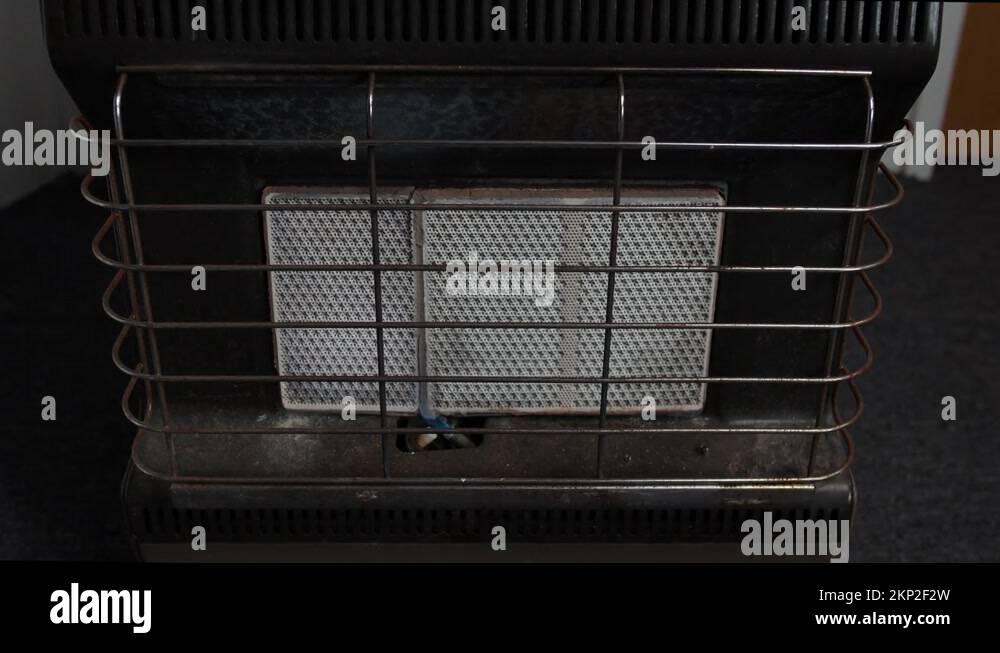 Ceramic butane gas heater igniting Stock Video Footage Alamy