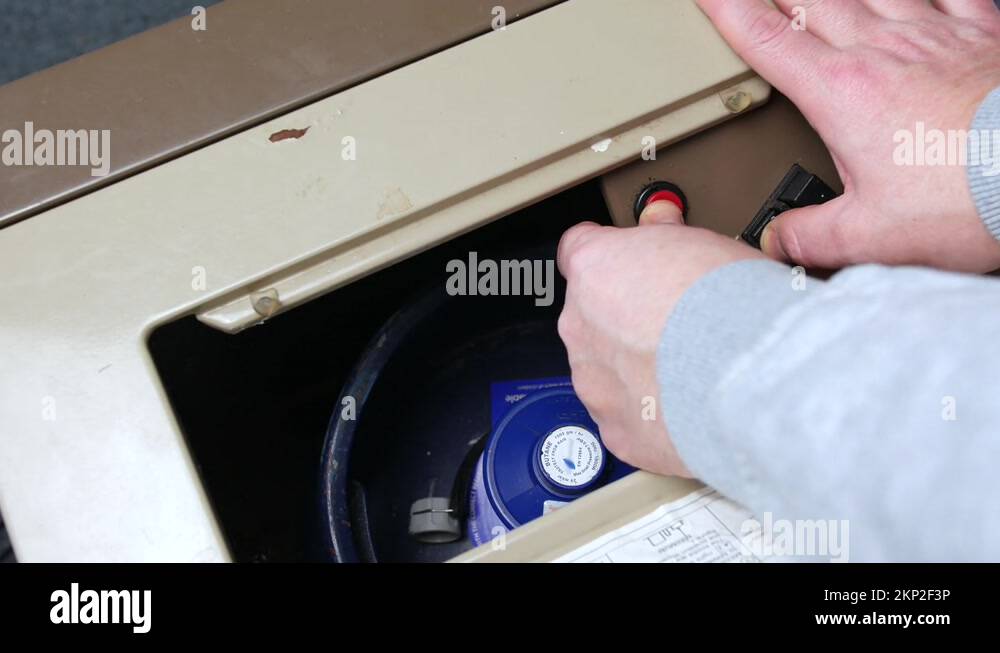 Igniting a ceramic butane gas heater Stock Video Footage Alamy