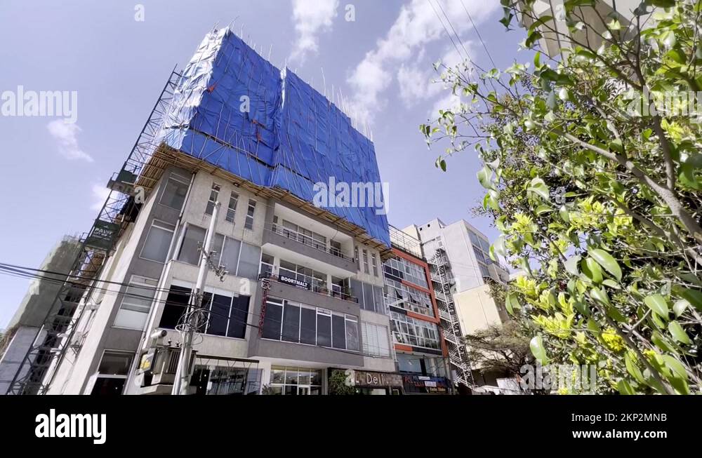 stick and bamboo scaffolding in use in addis ababa ethiopia Stock Video