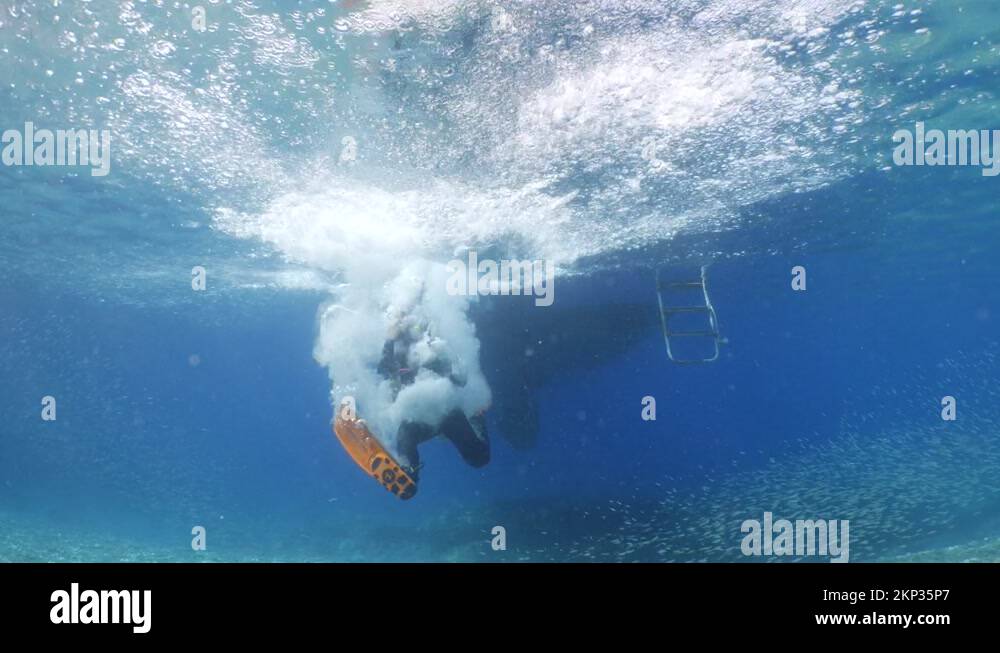 boat underwater scuba diver jumps into water ocean scenery Stock Video Footage Alamy