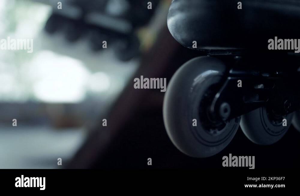 Active athlete having break after training skatepark. Man legs in