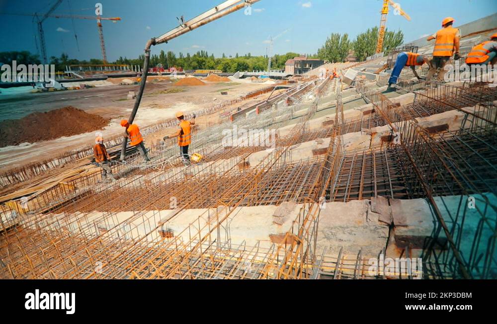 Working process at a construction site. Workers make a reinforced ...