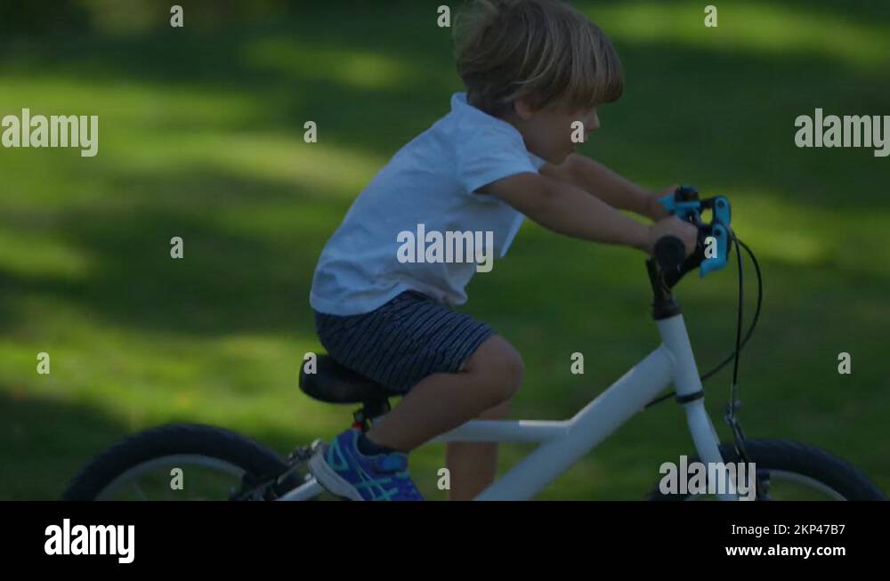 Child crashes bicycle falling to the ground kid real life accident Stock Video Footage Alamy