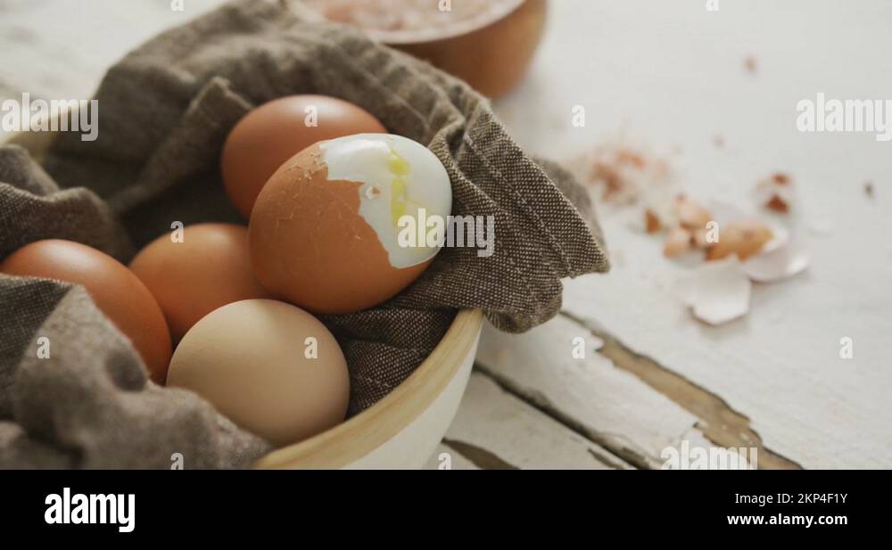 Video of close up of hard boiled brown eggs with cloth in bowl on rustic Stock Video Footage Alamy