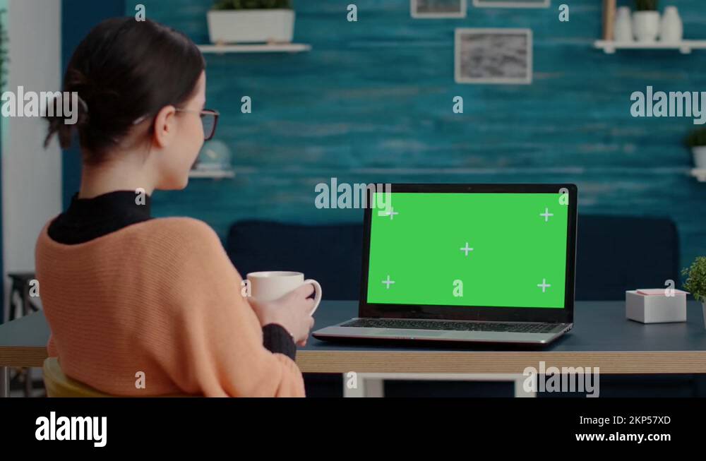Female student looking at green screen background on laptop Stock Video ...