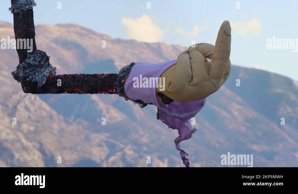 Kotor, Montenegro - January 20 2022: Arm of burning scarecrow, showing