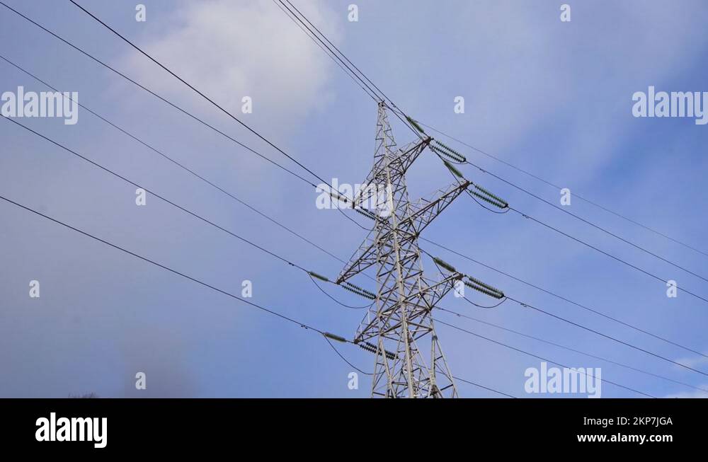 Huge Metal high-voltage tower with electric wires, the bottom view up ...