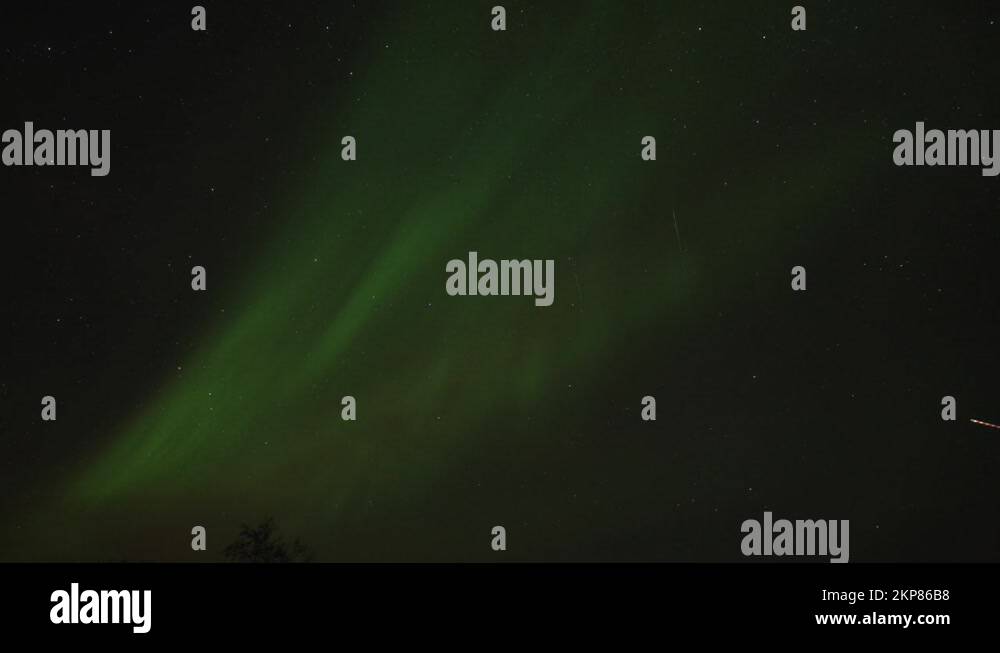 The beautiful dance of the northern lights in the night sky above the ...