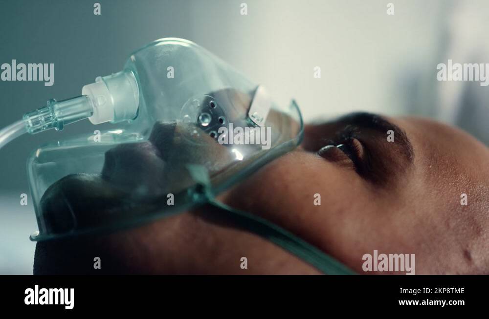Patient face breathing oxygen mask closeup. Infected man wear ...