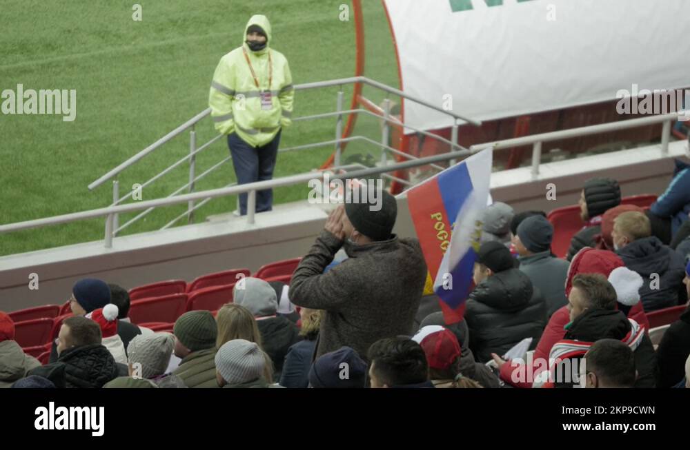 A Russian fan at a football stadium supports the Russian national team