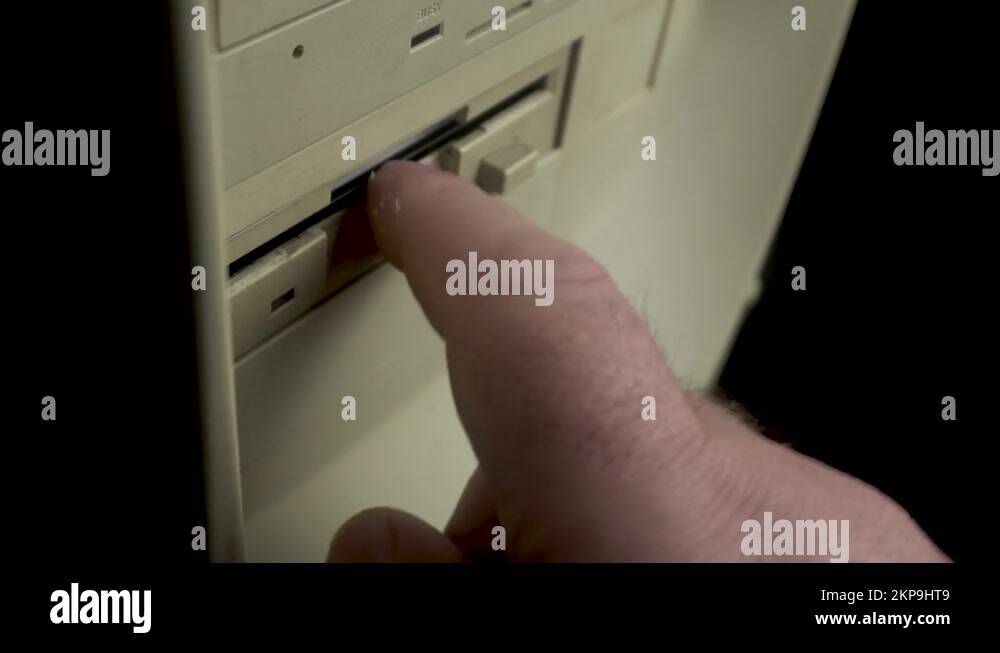 Anna Kournikova Virus on Floppy Disk, Hand Inserting Diskette In PC Drive Stock Video Footage