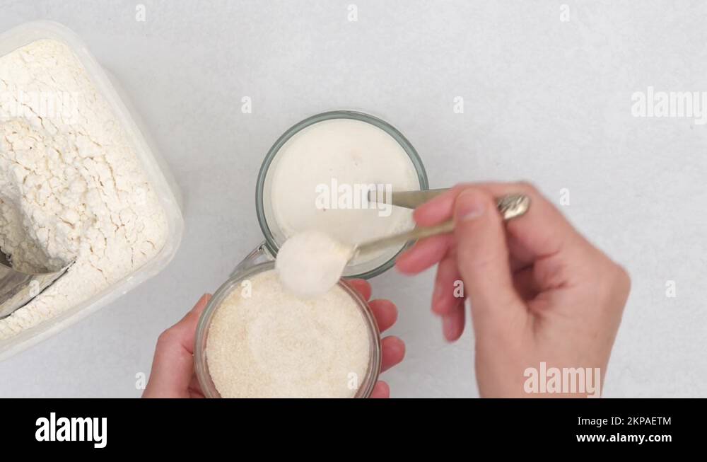 Step by step bread dough recipe. Mixing yeast starter and flour in a