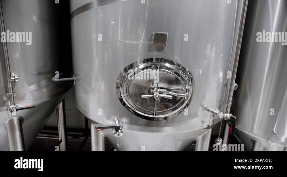 Stainless steel tanks for brewing beer. Huge stainless vats in a