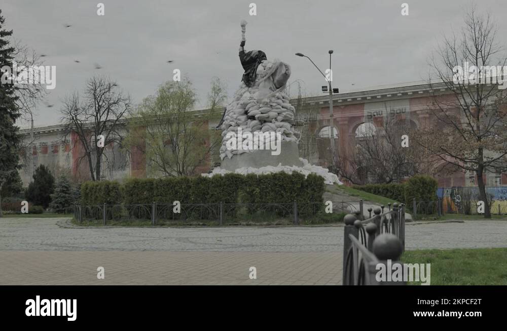 Fixed shot of a statue in Kiev, Ukraine covered with sandbags Stock
