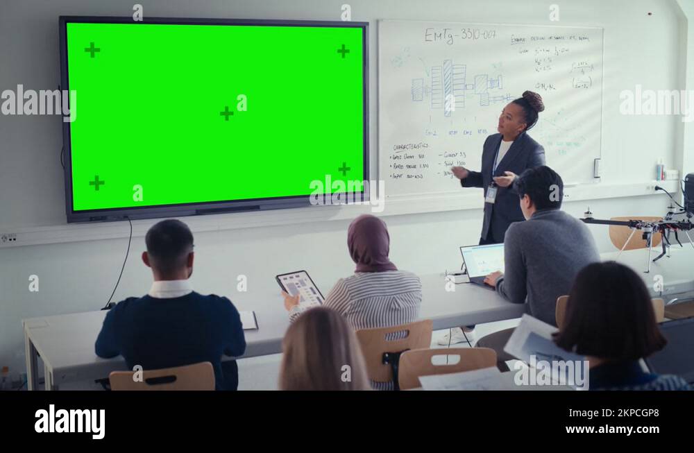 Teacher Uses Green Screen Digital Whiteboard Stock Video Footage - Alamy