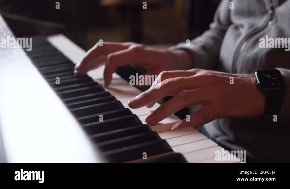 Man two hands plays classical music on a grand piano. Professional