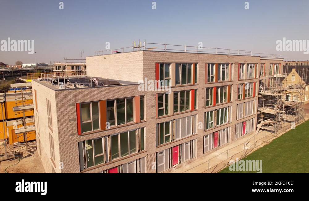 Ascending aerial showing construction site in Zutphen of real estate