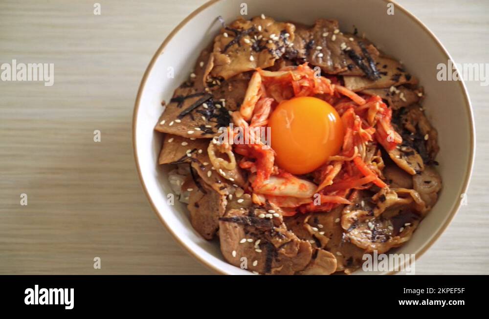 pork bulgogi rice bowl with kimchi and Korean pickled egg Korean food Stock Video Footage Alamy