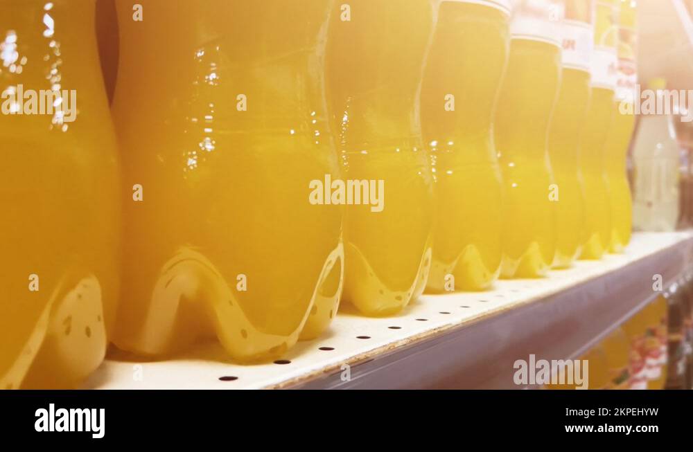 Citrus lemonade in plastic bottles is on the shelves of grocery store
