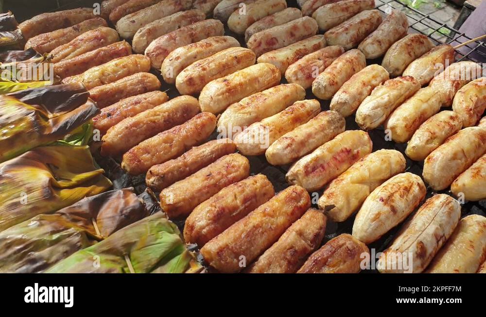 Charcoal grill banana yam and banana leaf sticky rice wrap Thai street