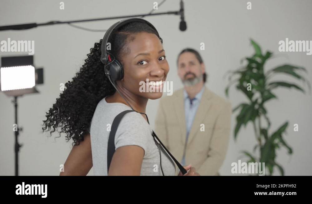 Female Sound Mixer Audio Technician Boom Operator on Set Behind the