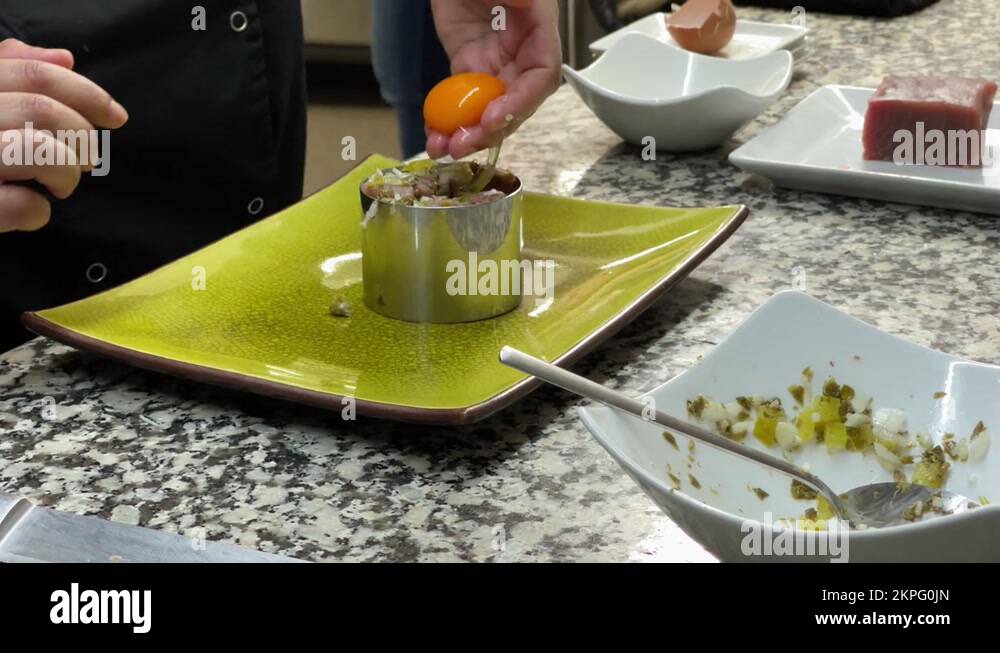 Egg yolk in top of a tuna tartare Stock Video Footage Alamy