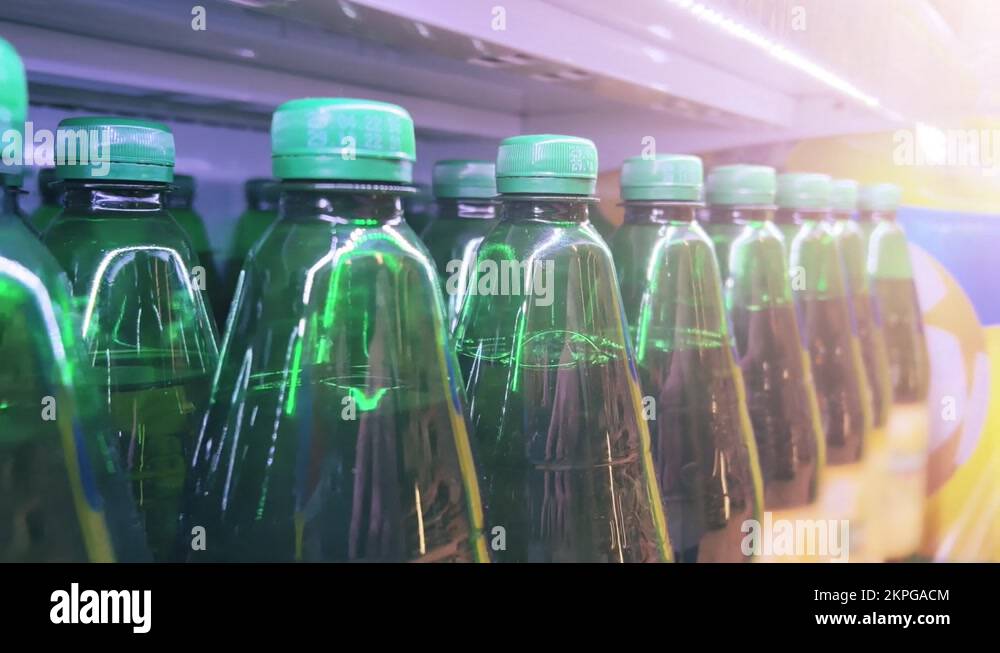 Beer in plastic bottles is on the shelf of a supermarket, liquor store or ABC Stock Video