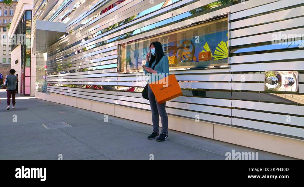 Young girl at Louis Vuitton shop on Rodeo Drive in Beverly Hills, Los