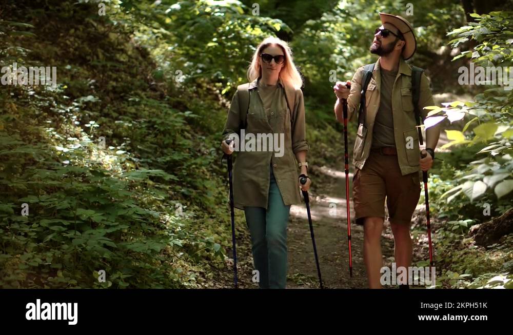 Trekker Nordic Walking Trekking Sticks In Wood. Trekker Tracking On Jungle Stock Video Footage