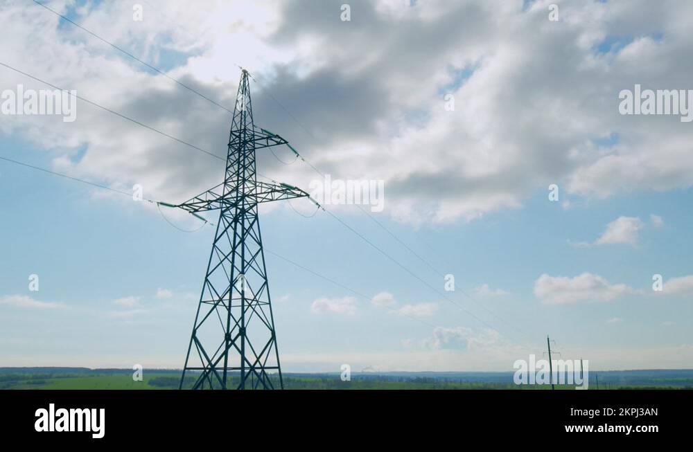 Electricity, high voltage power line pylon at day, silhouette and blue ...