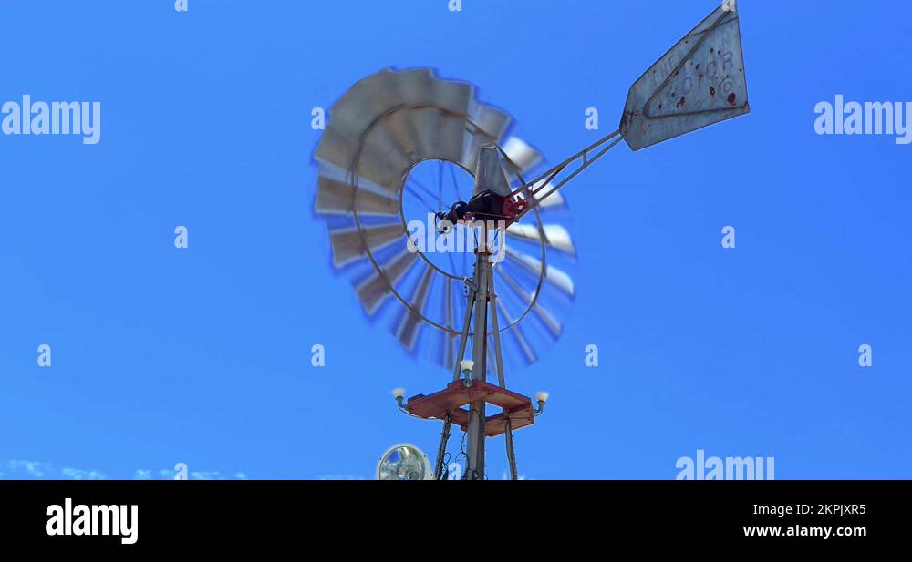 Steel windmill of a windpowered water pump in Los Angeles, California, 4K Stock Video Footage