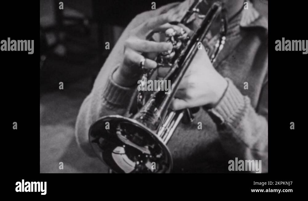 1950s Trumpet, French horn and tuba players together. Teacher