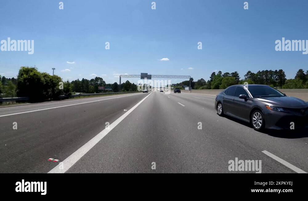 Rear view POV driving Bobby Jones Expressway Stock Video Footage Alamy