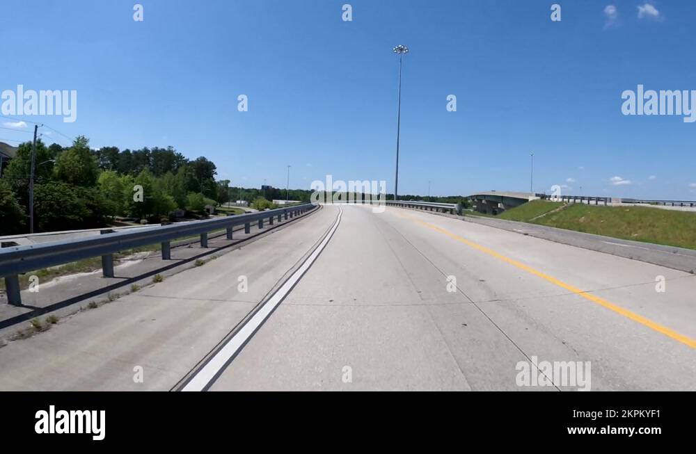 Rear view POV driving bridge i 20 and Bobby Jones Expressway Stock