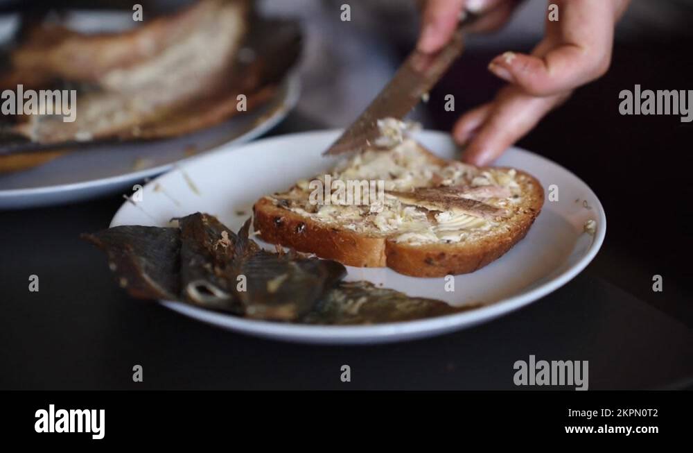 Smoked flavour flounder fish spread on a continental sandwich Stock