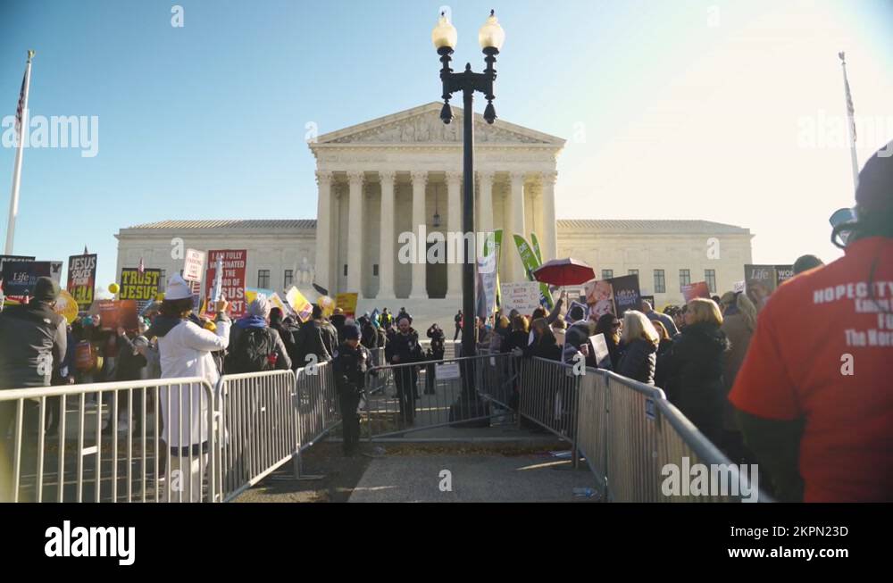 Both sides of a protest at the Supreme Court building separated by ...