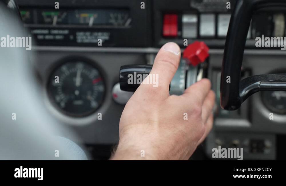 Pilot hand hold power stick while controlling small singleengine plane