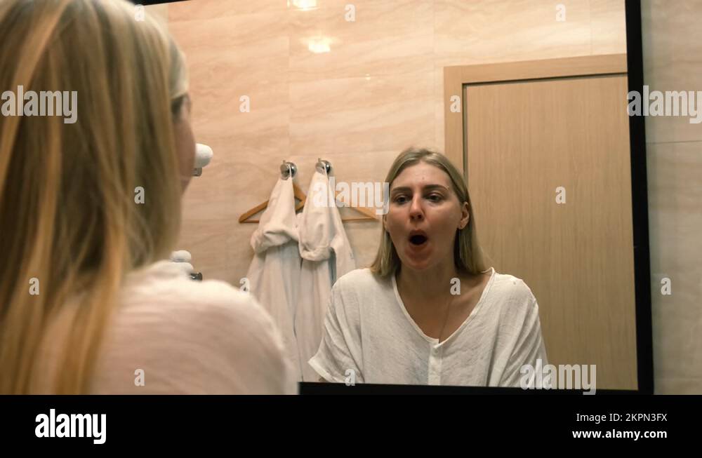 Ageing. Sagging skin. A young woman does facelift exercises Stock Video