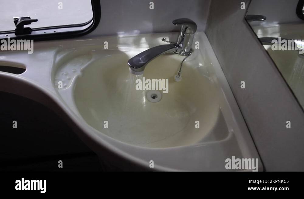 Closing an indoor shower water faucet in a motorhome. Closing a water