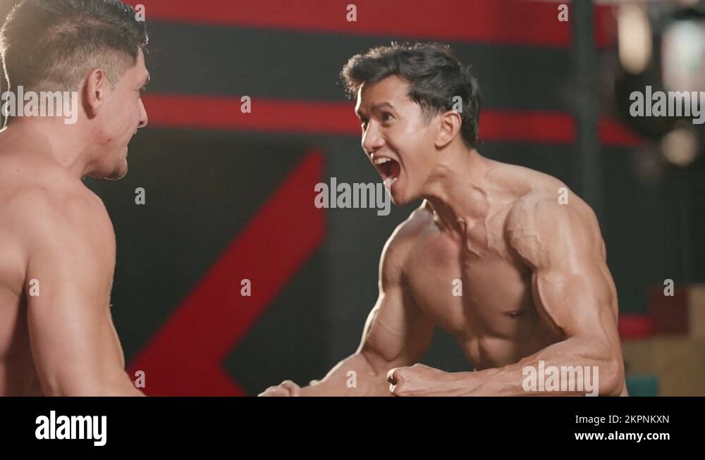 Two muscular man shirtless, showing chiseled torso, abs and pecs in