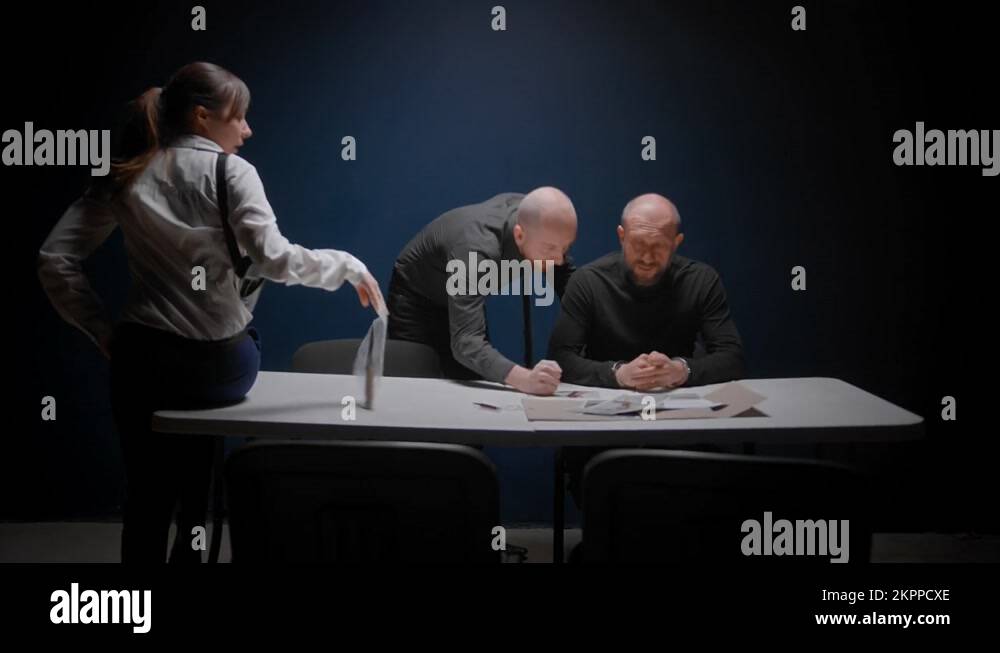Police interrogation without lawyer. Detective cop shows knife in blood